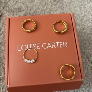 Four Louise Carter gold rings